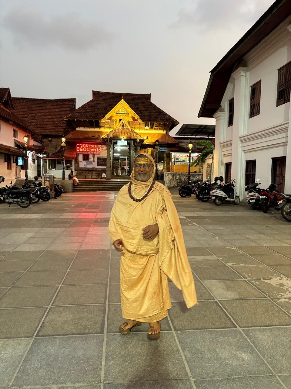 Guruji during tirtha yatra at a traditional South Indian temple — दक्षिण भारत के एक पारम्परिक मंदिर की तीर्थ यात्रा पर गुरुजी